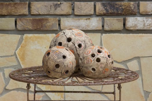 handmade balls of light on old metal table