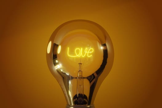 3D rendering background , Close up view, wording " love "" glowing light bulb with warm background .  Concept love , valentineday , summer love"
