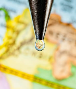 Africa can be seen through drops of water from a faucet