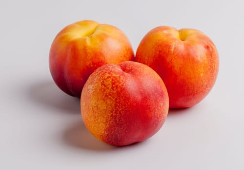 Three Nectarines on White Background