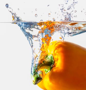 Orange Bell Pepper Dropping Into Water