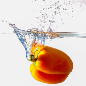Orange Bell Pepper Dropping Into Water