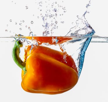 Orange Bell Pepper Dropping Into Water