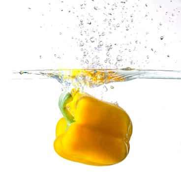 Yellow Bell Pepper Dropping Into Water