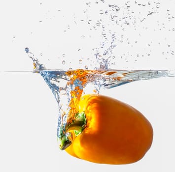 Orange Bell Pepper Dropping Into Water