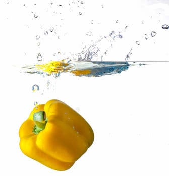 Yellow Bell Pepper Dropping Into Water