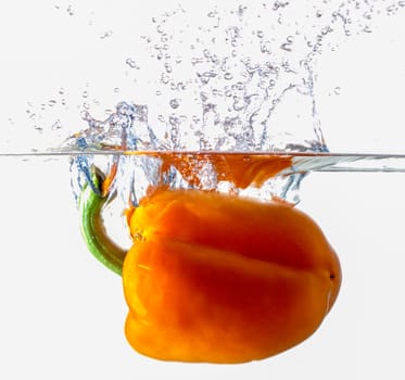 Orange Bell Pepper Dropping Into Water