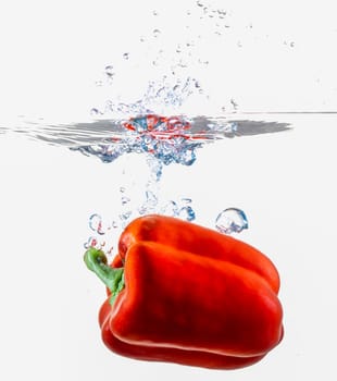 Red Bell Pepper Dropping Into Water