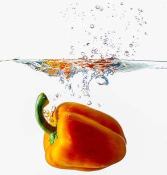 Orange Bell Pepper Dropping Into Water