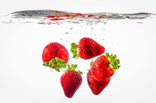 Ripe Strawberries Floating In Water