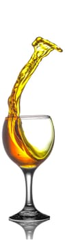 Yellow Liquid Splashing Out of Wine Glass