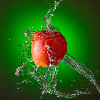 Water Splashing on Red Apple