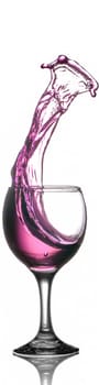 Purple Liquid Splashing Out of Wine Glass