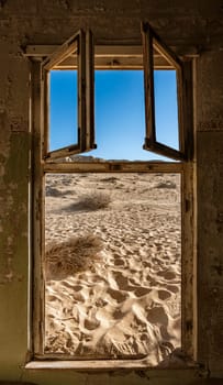Sand has invaded and taken over these rooms in Kolmanskoppe, Namibia