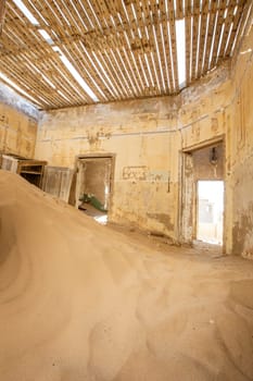 Sand has invaded and taken over these rooms in Kolmanskoppe, Namibia