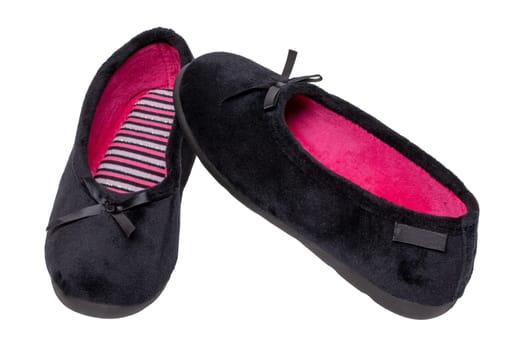Slippers isolated. Close-up of a pair of black female house slippers or ballerina shoes isolated on a white background. Macro of woman shoes.