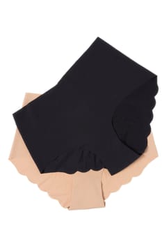 Underwear woman isolated. Close-up of beige and a black seamless panties isolated on a white background. Useful for wearing under bright or transparent dresses or under dark transparent dresses. Underwear fashion.