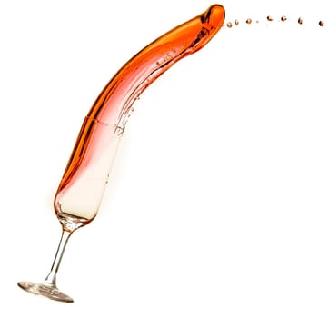 Wine being poured into glass, with slop spilling over.