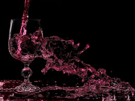 Wine splashes out of glass when poured