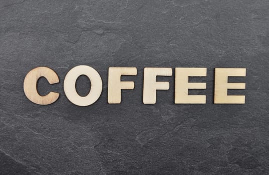 Term from wooden letters on slate board