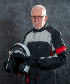 a portrait of senior biker with white helmet