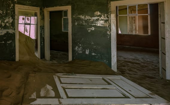 Sand has invaded and taken over these rooms in Kolmanskoppe, Namibia