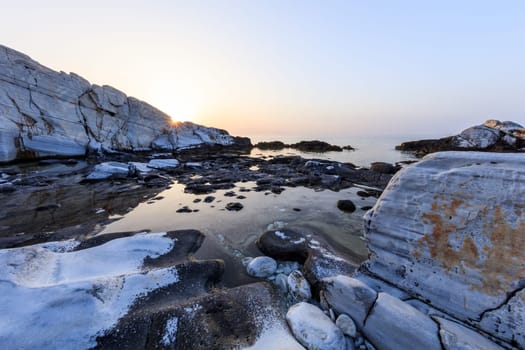Aegean seashore and marble rocks in Aliki, Thassos island, Greece
