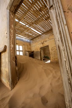 Sand has invaded and taken over these rooms in Kolmanskoppe, Namibia