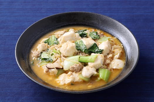 Chinese cuisine mapo tofu in a dish on wooden tray, Japanese style,
