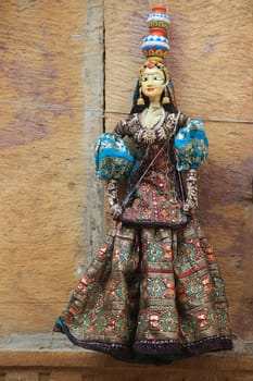 Rajasthani doll in colorful attire bearing pots on head dispalyed at Patawon-ki-Haweli in Jaisalmer Fort, Jaisalmer, Rajasthan, India, Asia