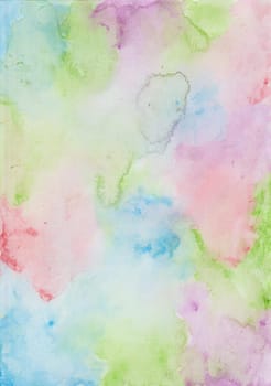 Colorful watercolor wash background with splashes of blue, green, purple and red