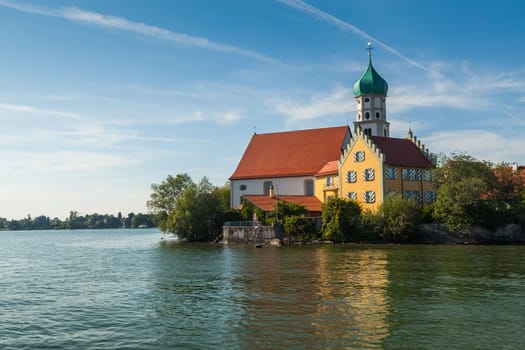 Historical church and castle build on small island in Wasserburg, Lake Constance (Bodensee) in Germany