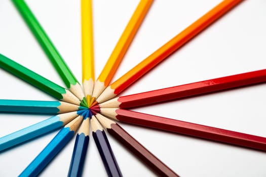 Some colorful wooden pencils on a white background