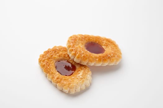 Two Cookies with jam on a white background