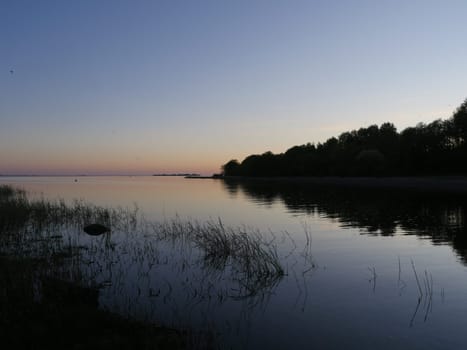 evening red sunset on a picturesque lake