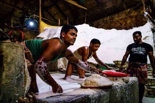 Chittagong, Bangladesh, December 22, 2017: Hard labor in a salt factory in Chittagong, Bangladesh