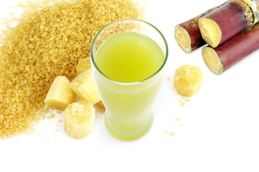 sugar cane juice and fresh sugarcane cut, cane, granulated sugar yellow brown