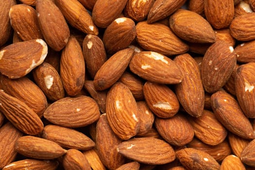 A lot of beautiful almond nuts as a background