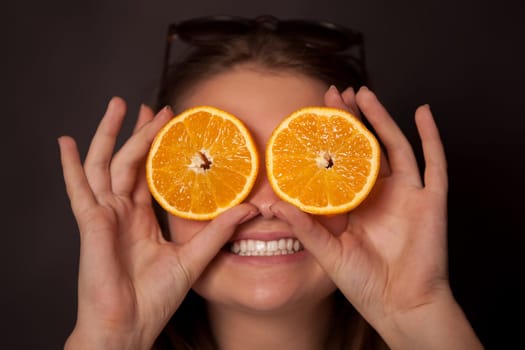 Girl with oranges in the eyes