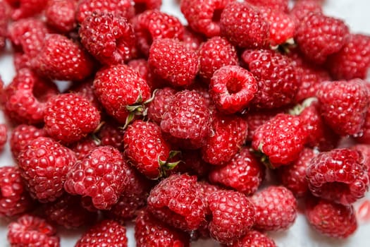 Fresh and sweet raspberries background.