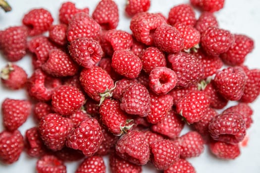 Fresh and sweet raspberries background.