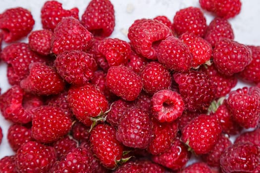Fresh and sweet raspberries background
