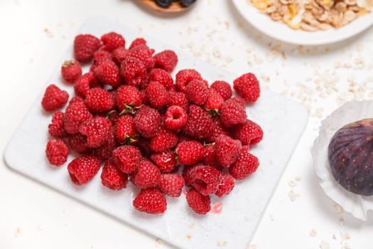 Fresh and sweet raspberries background.