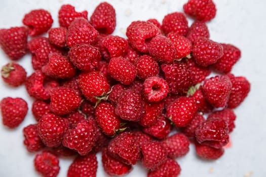 Fresh and sweet raspberries background