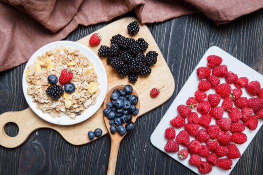 Cereal. Breakfast with muesli and berries. Top view, flat lay
