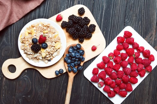 Cereal. Breakfast with muesli and berries. Top view