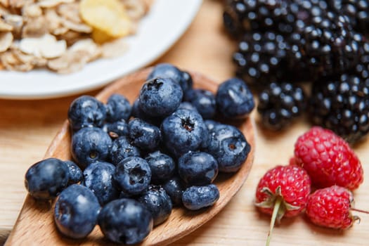 Fresh organic blueberries and raspberries in a basket.Blueberry and raspberry.Healthy eating,diet concept. Selective focus.