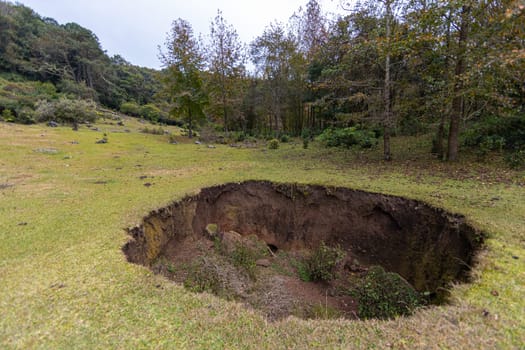Large sinkhole in a valley in the middle of the mountains in el Cielo, Tamaulipas, Mexico