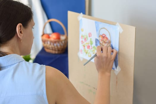 Novice artist tries to paint still life in the studio