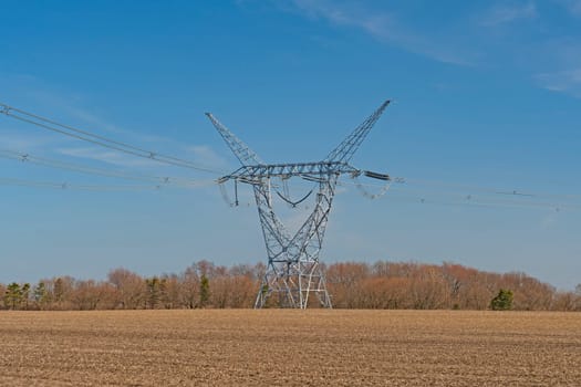 High Power Transmission LInes and Tower in a Remote Farmland in Midewin National Tallgrass Prairie in Wilmington, Illinois